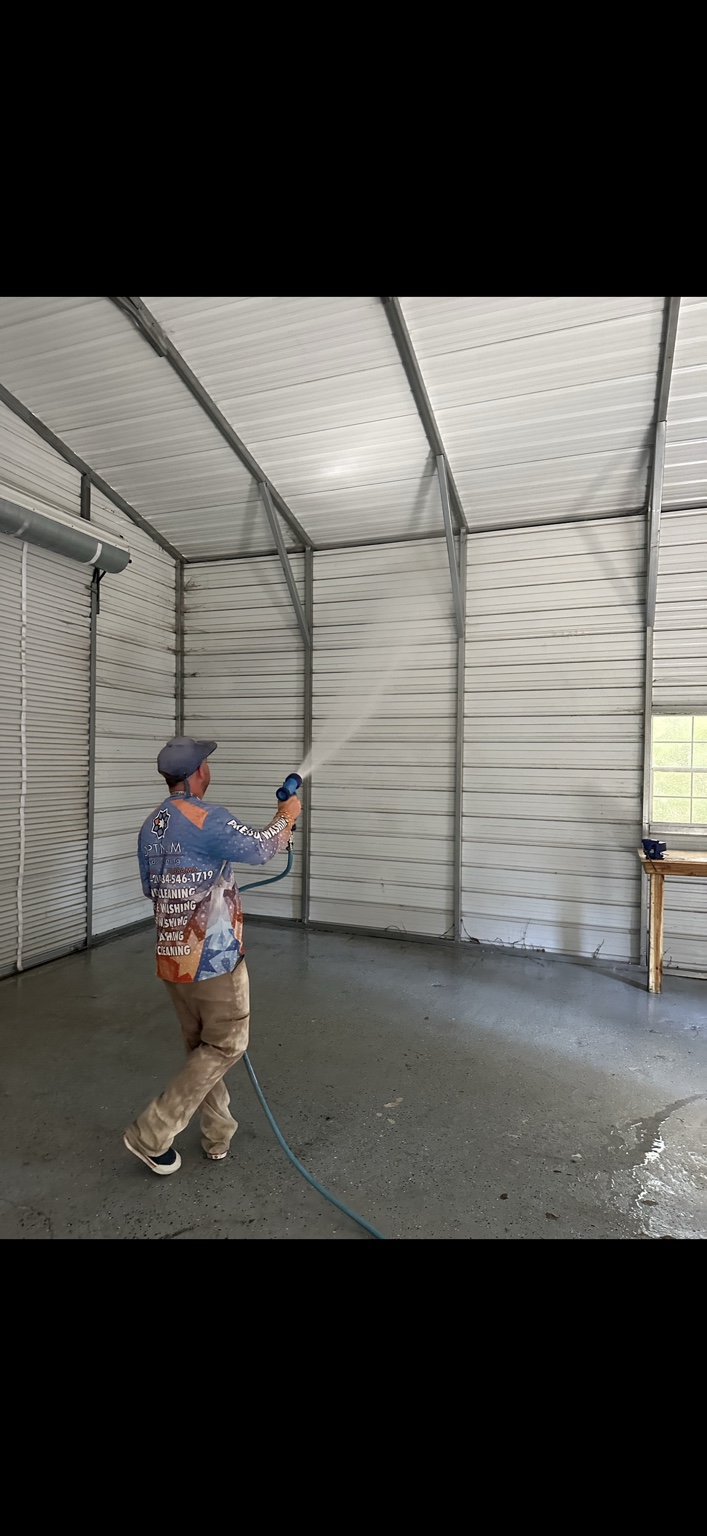 Optimum technician soft washing the interior of a commercial building